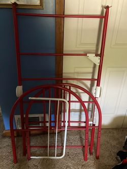 Red metal toddler bed