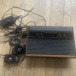 Atari with games and a controller