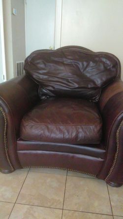 Big one seater brown leather couch