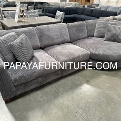 Brand new in box. 125” x 58” sectional with Large chaise. Soft corduroy fabric. Dark grey. Also available in camel tan color. Pick up or delivery. Fin