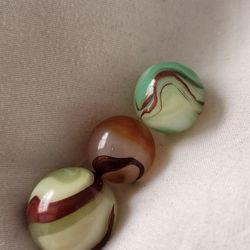 Three Beautiful Oxblood Marbles