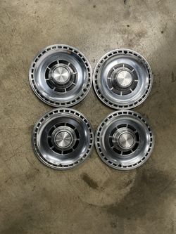 Set of 4) 14" Chevrolet Motor Division hubcaps from 69 El Camino
