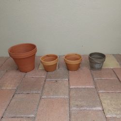 Preowned set of four small clay flower pots great for orchids