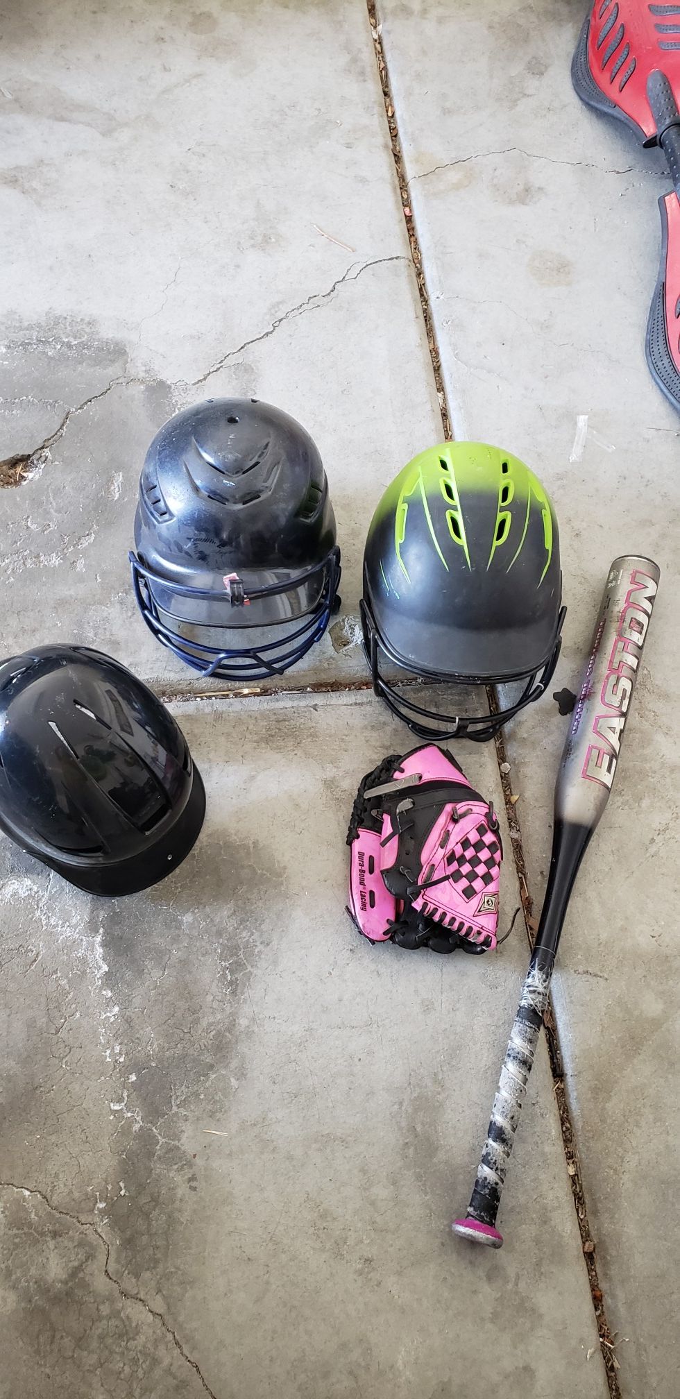 Helmets, small glove and softball bat