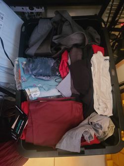 TOTE FULL OF MENS CLOTHING