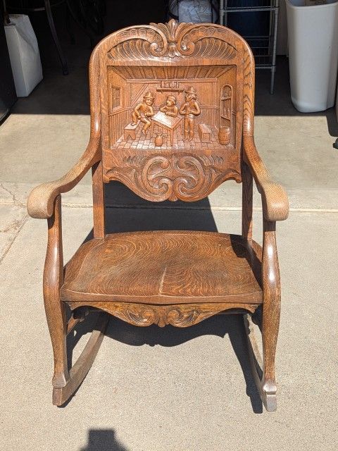 1910 German Hand-Carved Oak Rocking Chair