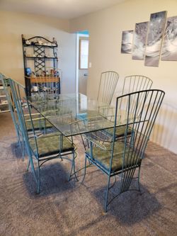 Glass Dining room table with six chairs
