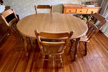 Solid wood country style dining table and 4 chairs!! Can be used oval or round.