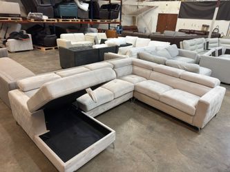 Fabric sectional couch with storage chaise.