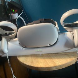 Meta quest 2 and case and charging dock and head strap (everything brand new)