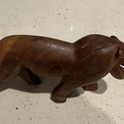 7 inch long wood carve Lion