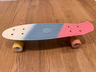 22” Skateboard – fun pink/blue/white design with colorful wheels.