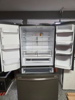 GE gas stove, refrigerator, microwave range, & dishwasher