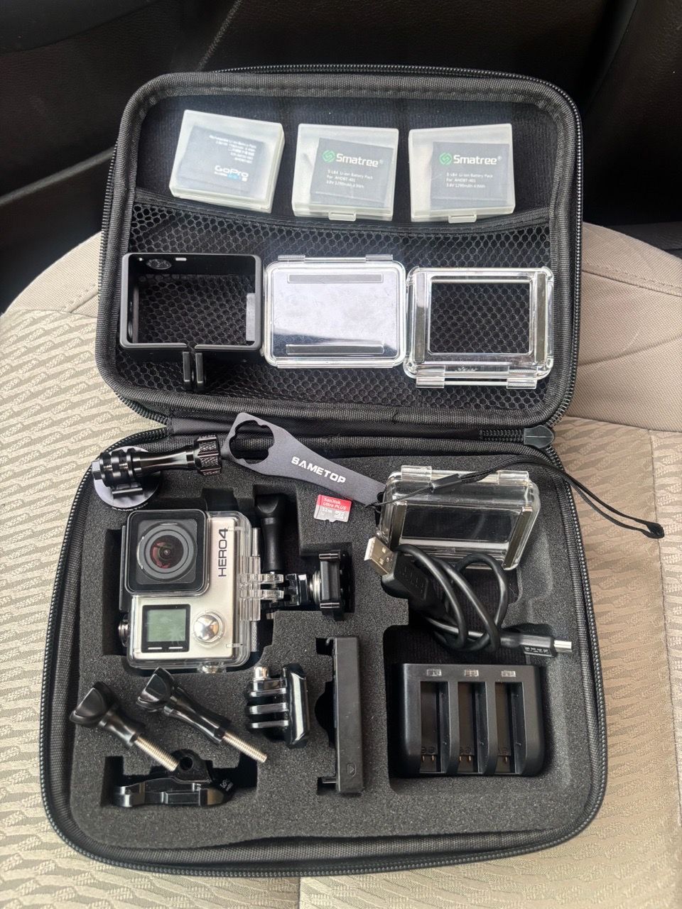 GoPro HERO4 4K Action Camera Mega Bundle – 4 Batteries, Charger, Cases ...