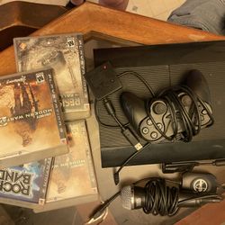 PS3 Fat Console With A Couple Games A Rock Band