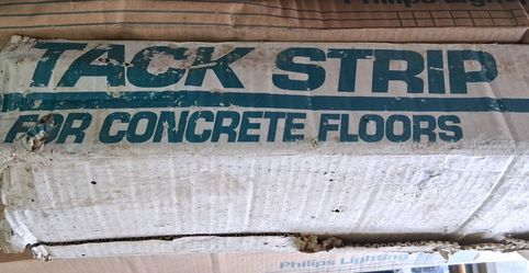 Tack strip for concrete floor