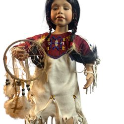 Ashton Drake Native American Girl Porcelain Doll  The doll and clothing are in excellent condition with no issues. The doll may be missing a part as i