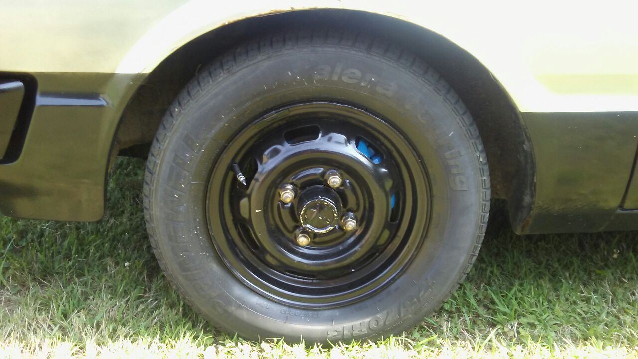 TRADE ONLY A SET OF 13 INCH STEEL RIMS WITH TIRES IN GOOD CONDITION