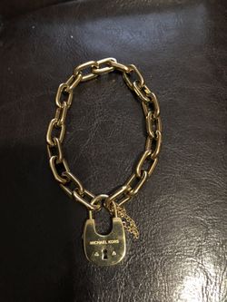 Authentic Michael Kors gold tone lock bracelet!