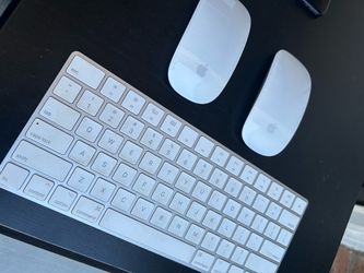Apple Magic Keyboard and Two Magic Mice