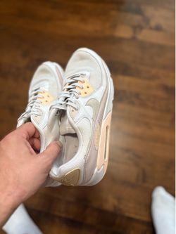 Nike Air Max sneakers in a clean light beige