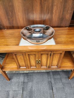 Side table with expanding top to prelude white laminate space for service. Also has compartment in middle with ornate door