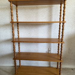 Two wood spindle bookcases