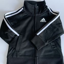 Stylish Adidas track jacket in black with white stripes. Perfect for casual wear.