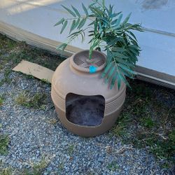 Plant covered cat litter box