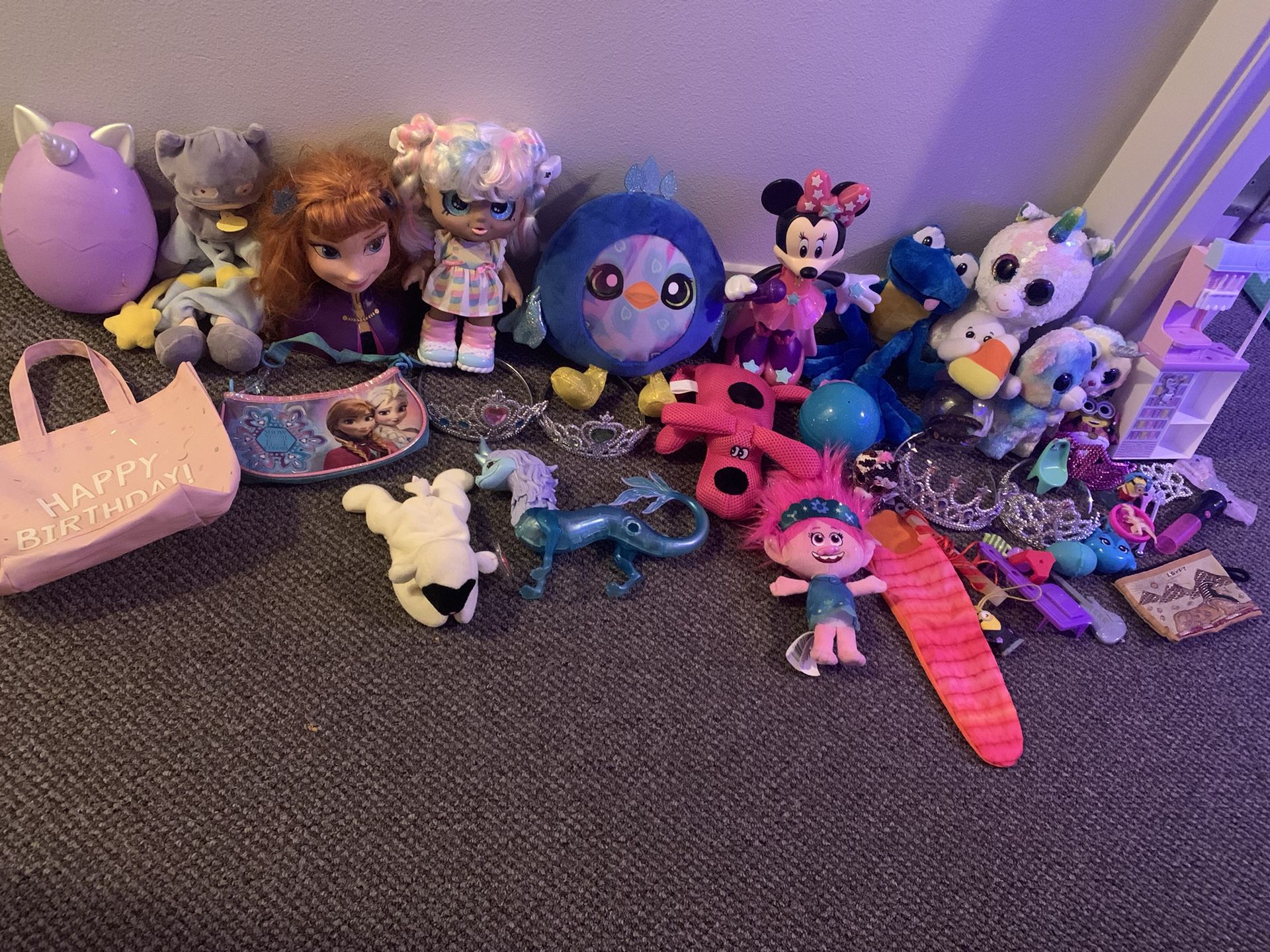 Girls fun toy lot.  Includes Elsa Anna frozen toys, stuffy’s, unicorns, fun dolls, trolls, purses, Minnie Mouse dancing and light up sing along toy., 