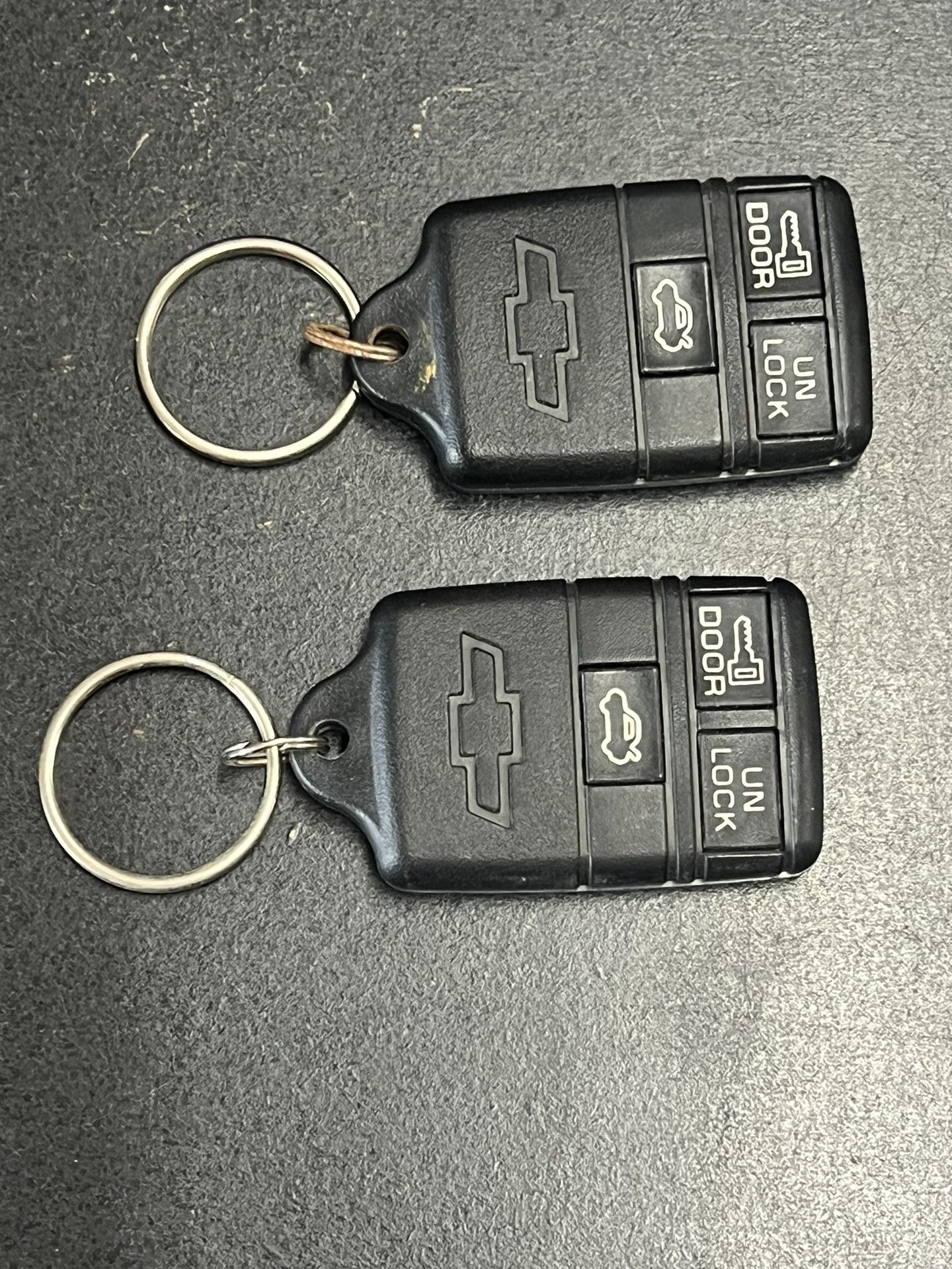 Lot of 2 TRW Chevy Chevrolet Key Fobs ABO 0104T 