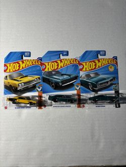 Hot wheels car lot of 3 ( Dodge, Mercury and Buick)