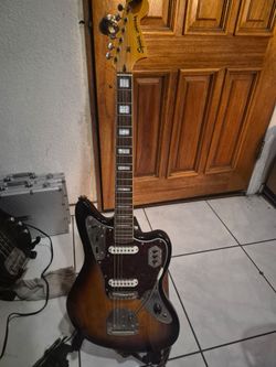 Squier fender jaguar guitar with fender mustang amp and cords