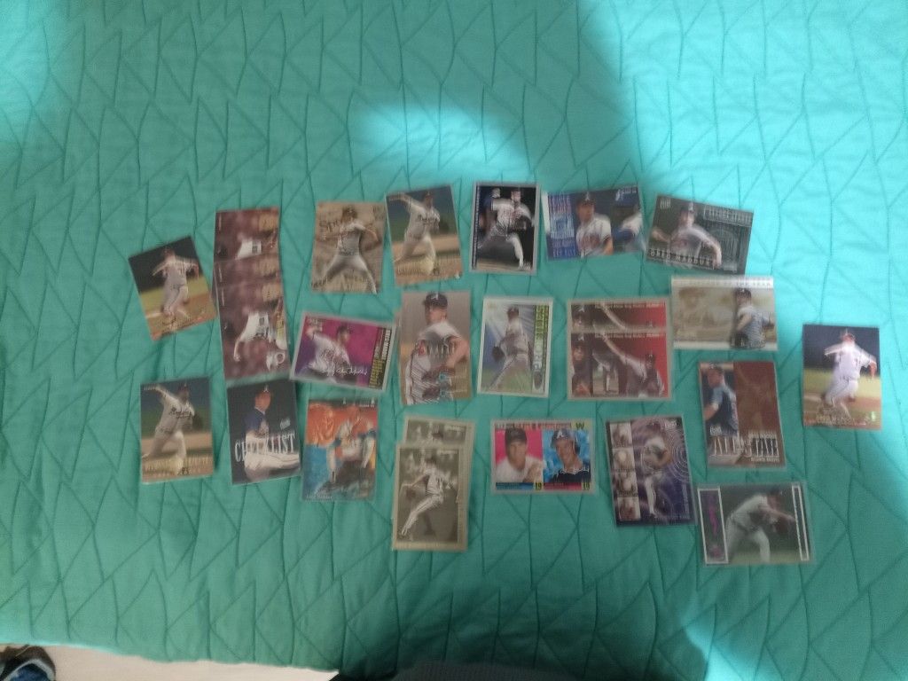 28 Various Greg Maddux Baseball Cards