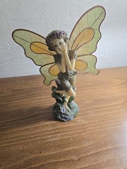 decorative woodland fairy figurine .