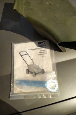 Neutron mower manual, wrench and chute *mower not included