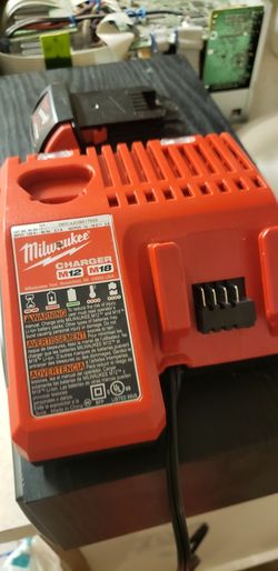 Milwaukee M12/M18 Fast Charger, M18 Battery, And Case