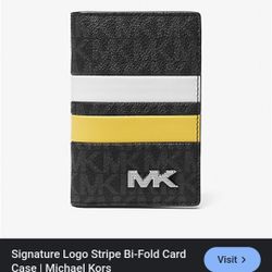 Michael Kors (MK) wallet, specifically the Cooper Signature Logo Stripe Bi-Fold Card Case. / Wallet