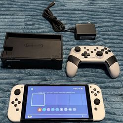 Nintendo switch OLED with charger, docking station, and controller. No trades cash only. Check my page for other gaming stuff as well.