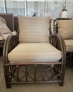 2 wicker and fabric chairs