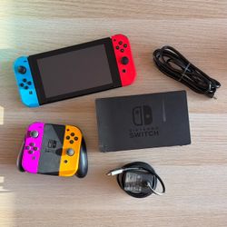 Nintendo Switch with extra Joy-Con and grip