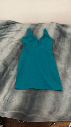 Decosta turquoise dress with a deep V-neck and sleeveless design