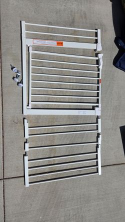 Baby gate with three extenders