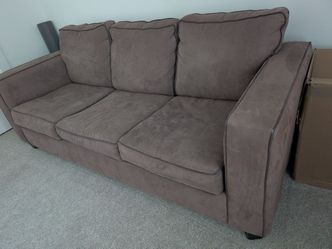 Brown couch with pullout mattress/bed