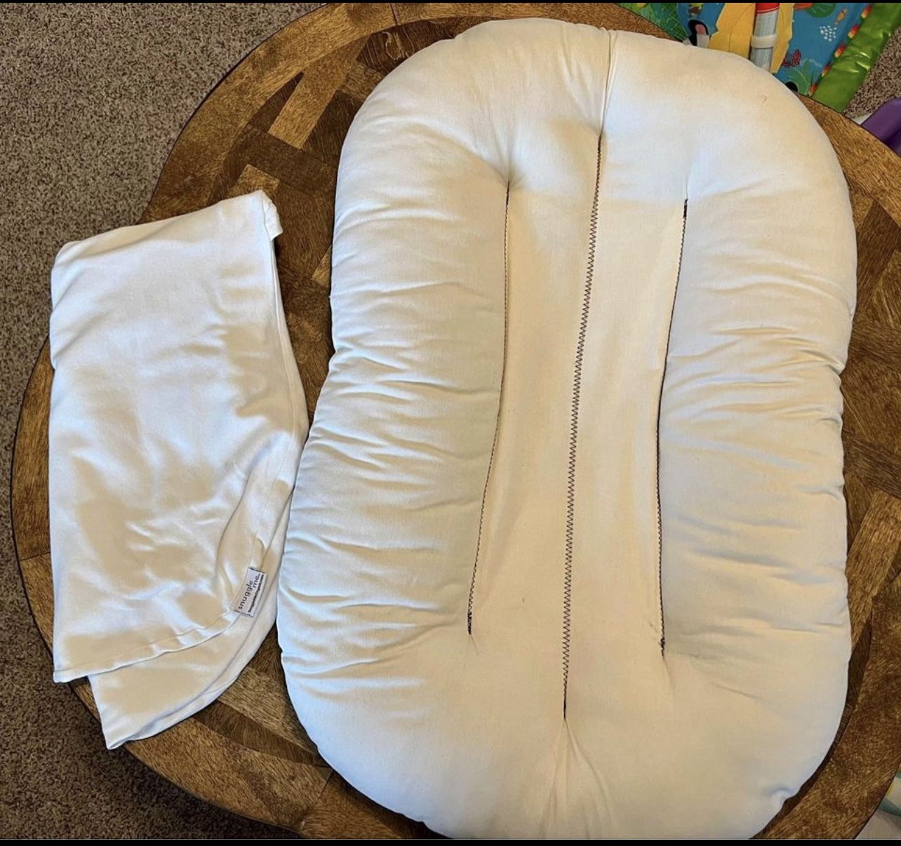 Snuggle Me baby lounger with white cover