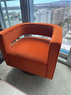 Orange Wayfair swivel velvet accent chair - brass base