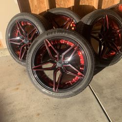 20” Black And Red Rims With 3 Out Of 4 Tires 