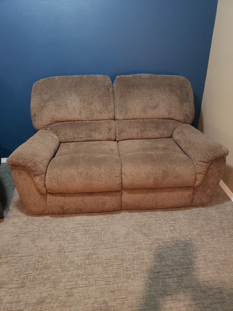 Dual reclaiming love seat