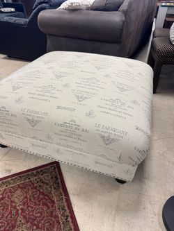 French Script Upholstered Ottoman with Nailhead Trim