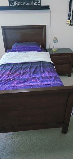 Twin bed with night stand.